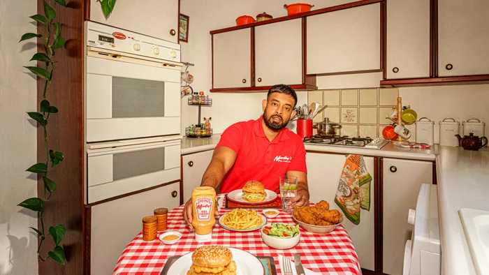 Morely's fried chicken on a table with food